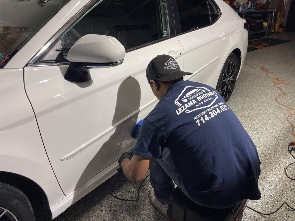 Detailing a white SUV on-site